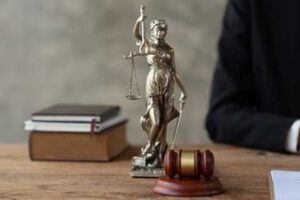 Lady Liberty on desk with a gavel