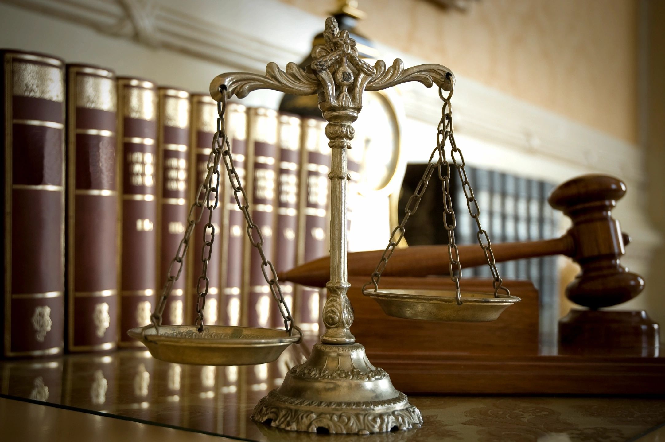 Scales of justice with gavel and law books